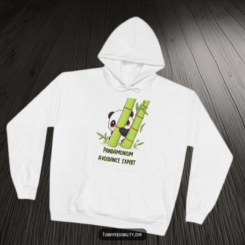 Funny shy panda hiding behind a green bamboo stalk, featured on a cozy hoodie, offering a sense of comfort and quietude.