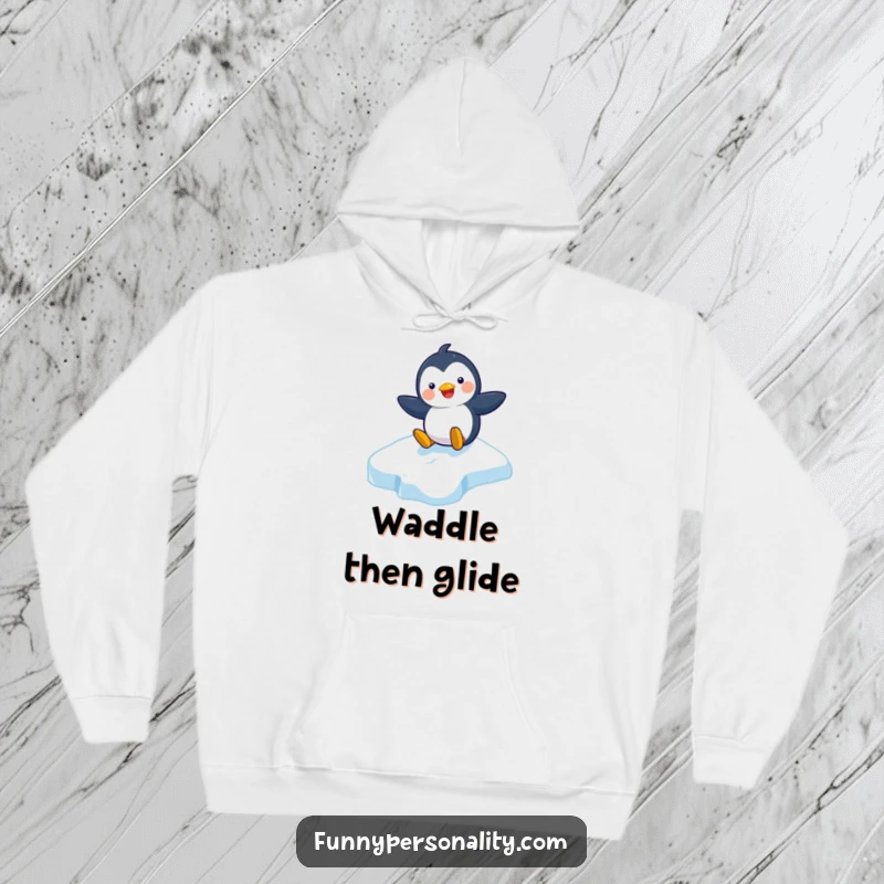 Funny hoodie depicting a playful penguin character sliding gleefully down an icy slope, offering warmth and winter cheer.