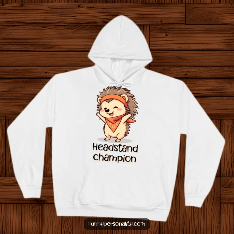 Funny Hoodie with a cheerful hedgehog in a bandana attempting a handstand, offering warmth and a good laugh.