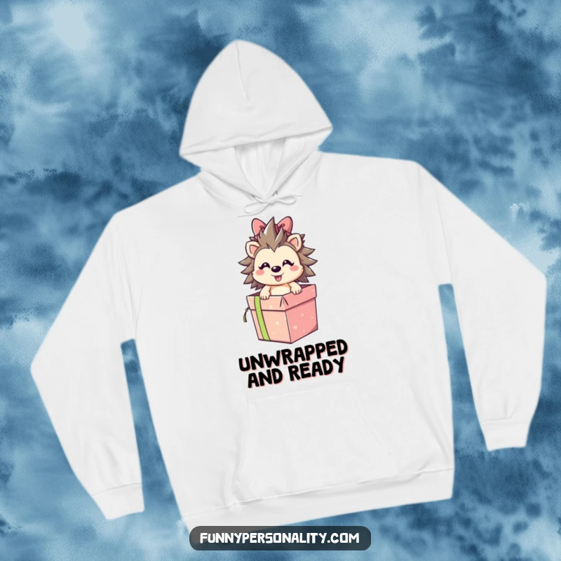 Smiling hedgehog character bursting out of a gift box, depicted on a soft hoodie, bringing cheerful surprise and a funny gift.