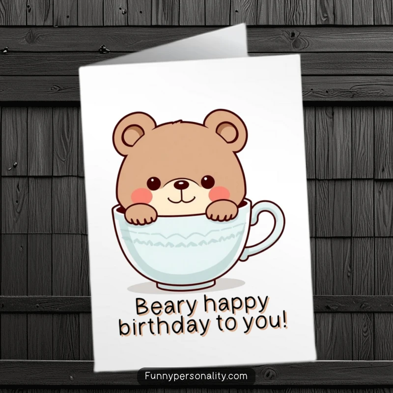 Funny Free Printable Birthday Card: A cute bear with a curious smile peeks out from a massive teacup, ready for fun.