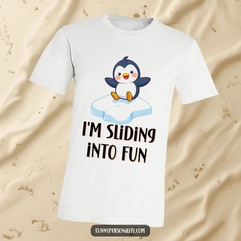 Funny t-shirt featuring a playful penguin character joyfully sliding down an icy slope, radiating happiness and fun.