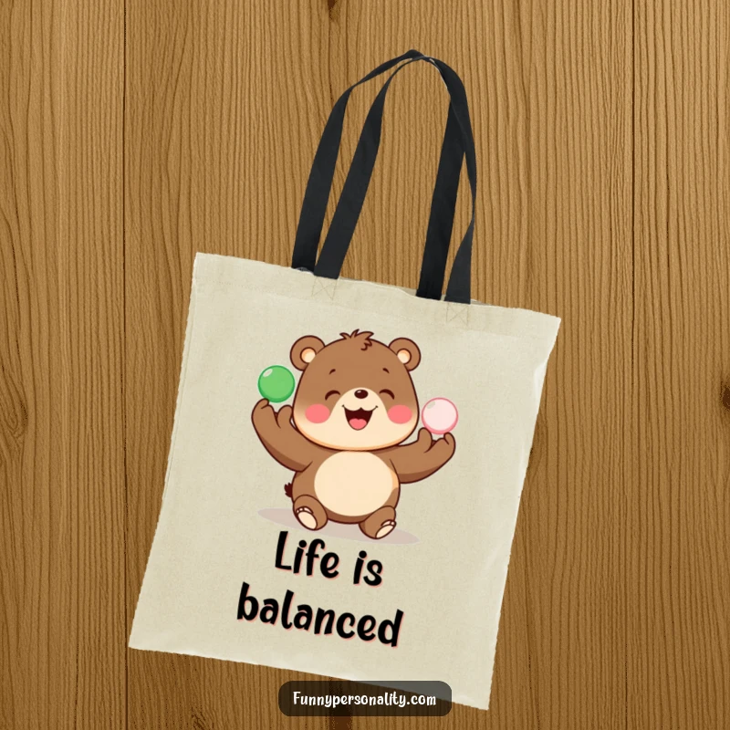 Funny tote bag features a happy bear juggling bright balls, perfect for carrying essentials with a smile.